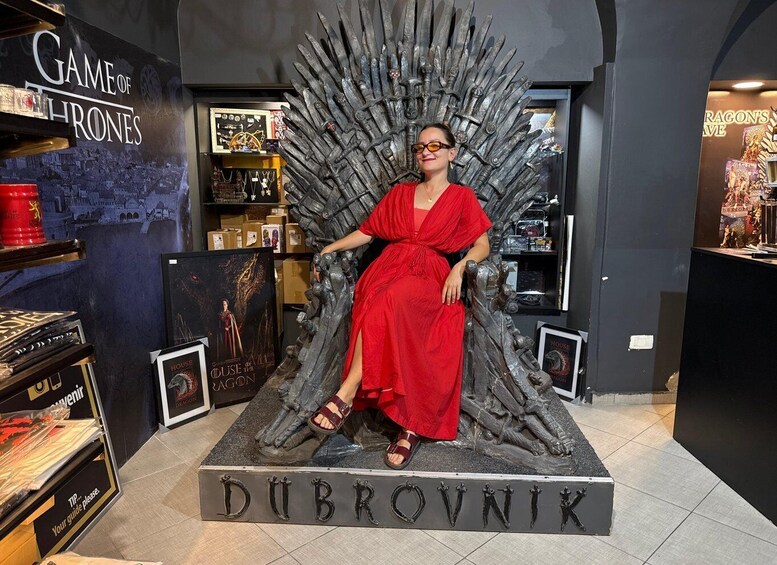 A person seated on a throne-like structure with the name 'DUBROVNIK' at the base. 1