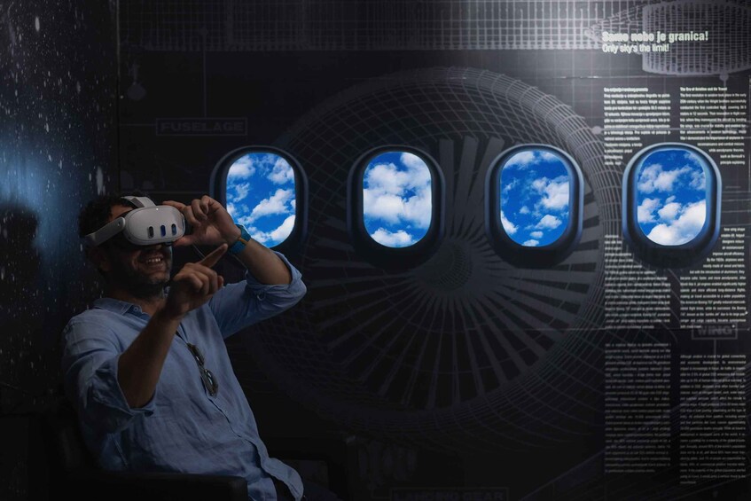 A person using a virtual reality headset with a view of the sky through the windows. 2