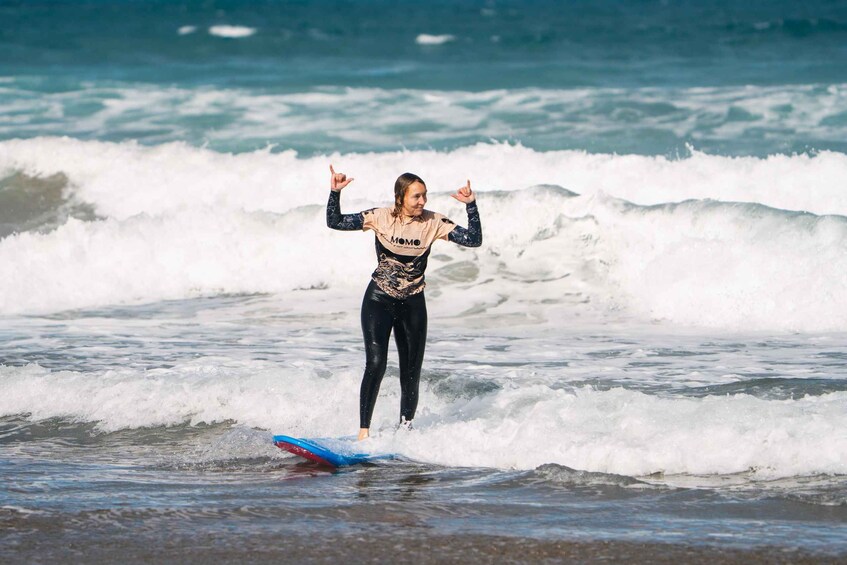 A person surfing on a wave. 1