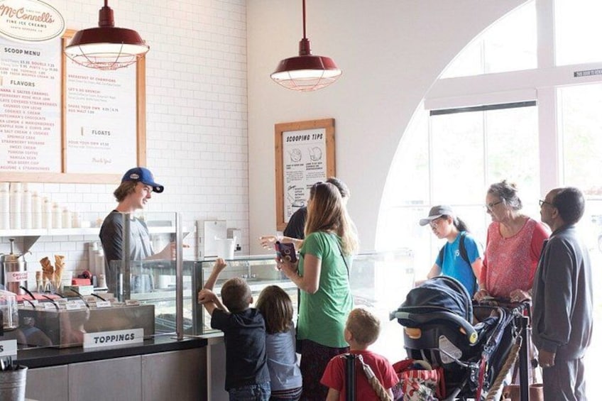 A food service area with a counter, menu boards, and a window. 2