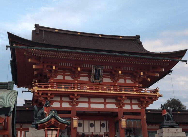 A traditional Japanese building with a curved roof and ornate wooden structures. 1