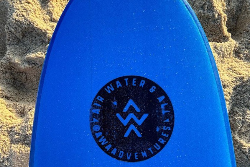 A blue surfboard with a logo and text on it. 2