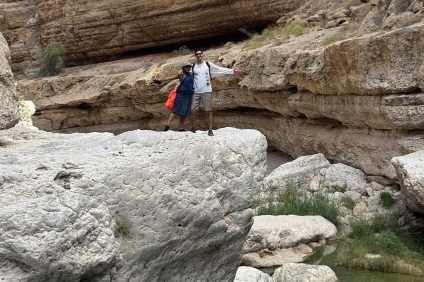 A rocky landscape with large boulders and a narrow passageway. 2