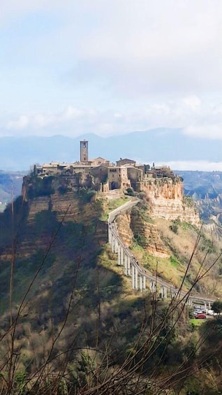 A historic stone fortress on a cliff overlooking a valley. 4