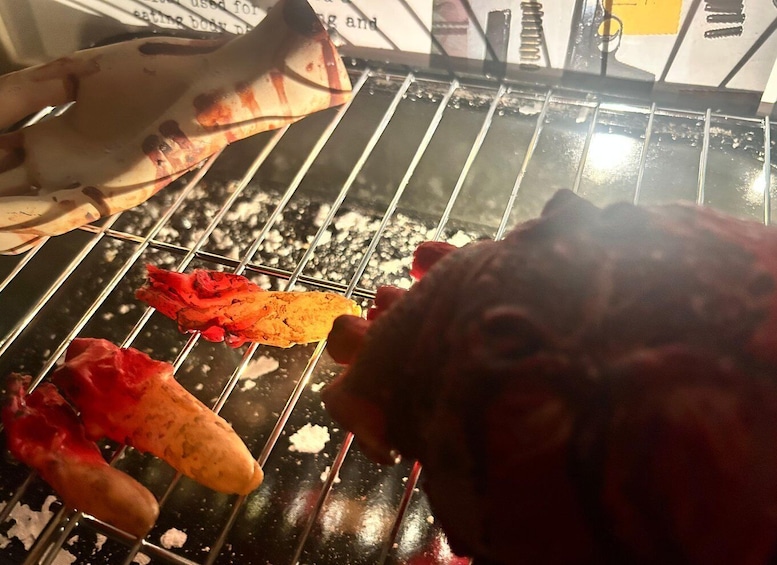 A grill with food items being cooked. 1