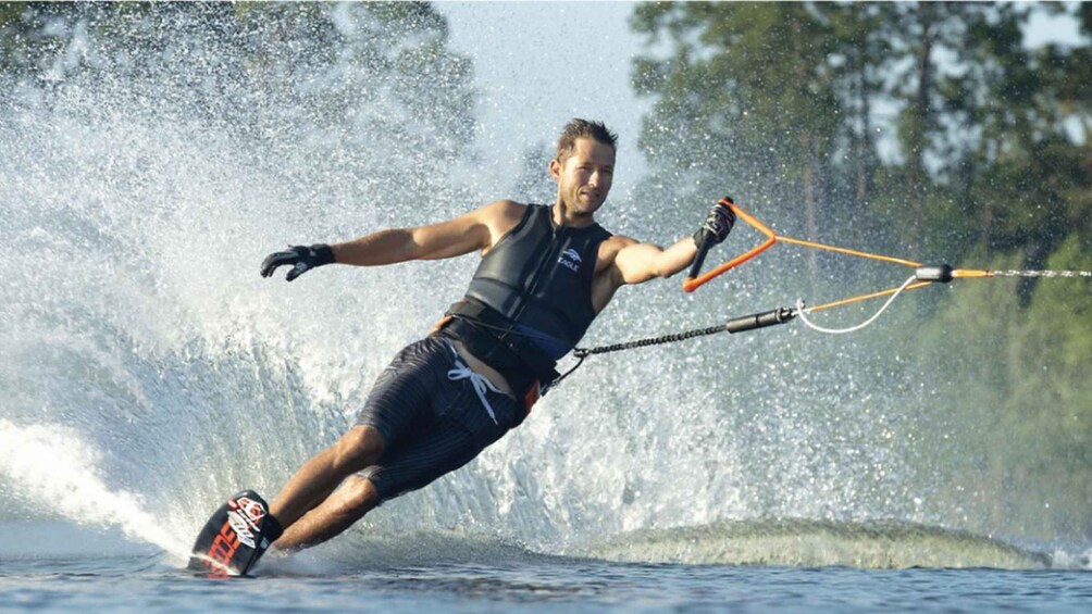 A person wakeboarding on a body of water. 5