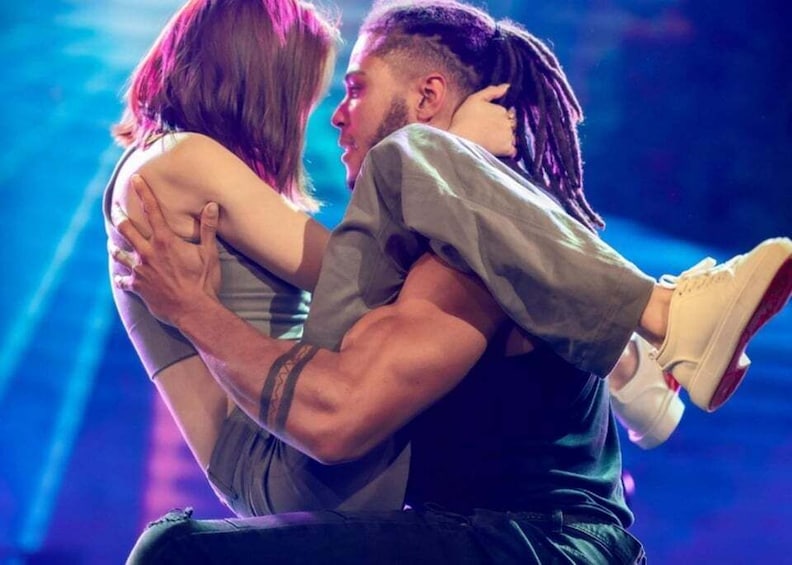 A person holding another person in a close embrace. 1