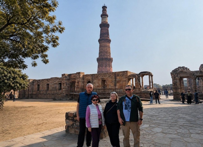 A historical site with a prominent tower and ancient ruins. 2