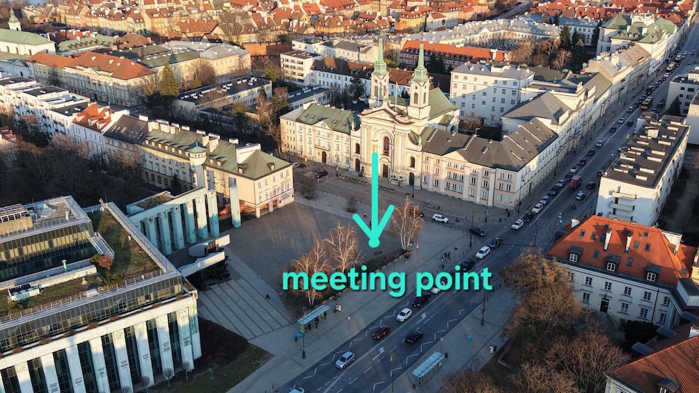 An aerial view of a city with a prominent building marked as a meeting point. 5