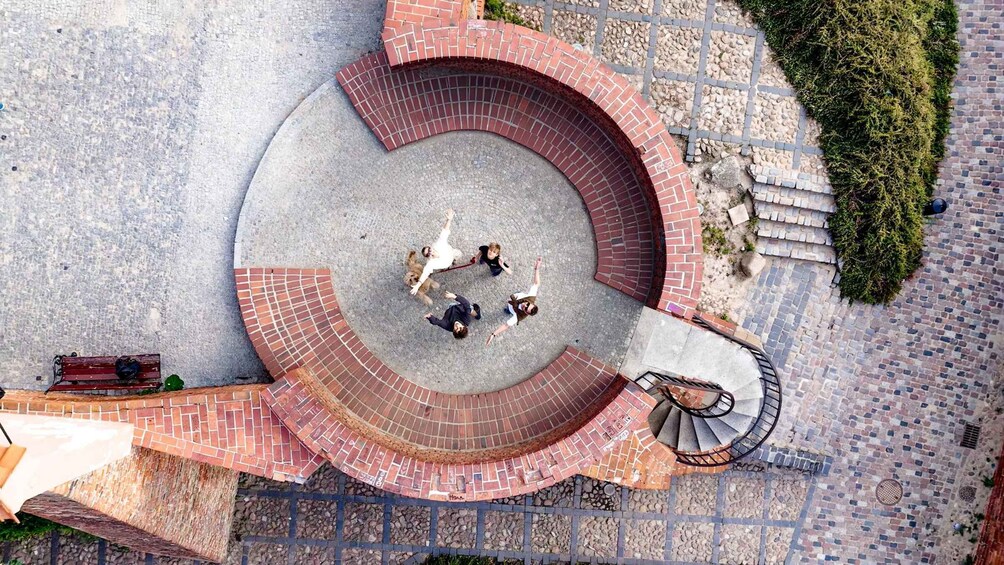 A circular brick structure with a spiral staircase. 4