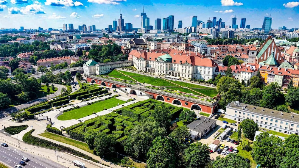 A cityscape with a historic building, a modern skyline, and a well-maintained park. 1