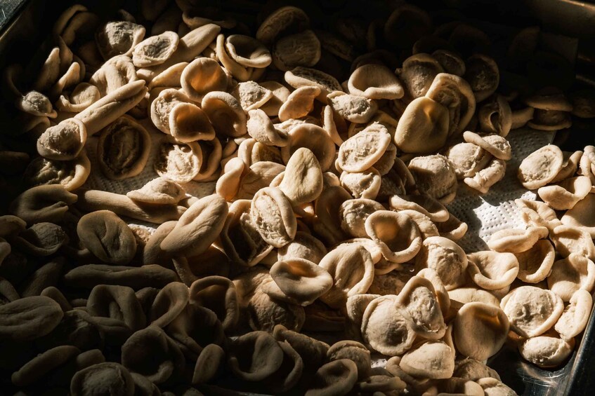 A tray of uncooked pasta shapes. 3