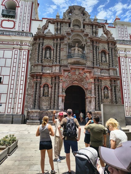 A historic building with ornate architecture and a large entrance. 3