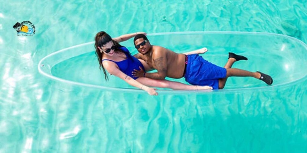 Two people floating on a clear blue water surface. 5