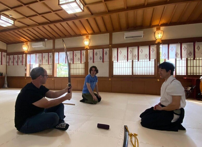 A traditional Japanese room with tatami flooring, shoji screens, and a wooden ceiling. 3