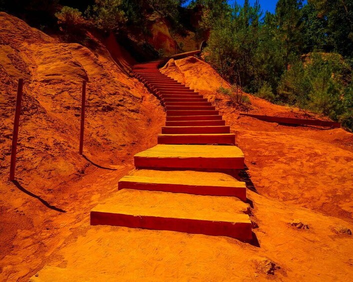 A staircase leading uphill in a red-hued landscape. 5