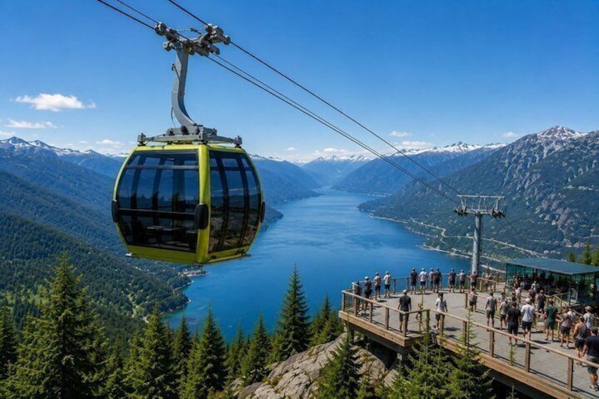 A cable car over a lake with mountains in the background and a viewing platform below. 5