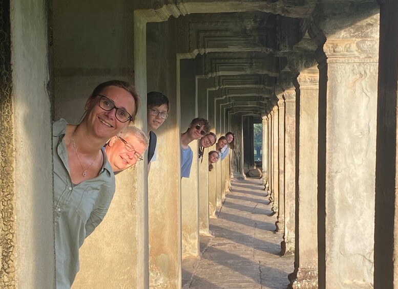 A corridor with columns and a reflective surface. 3