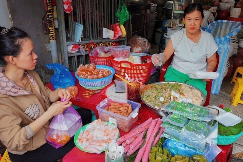 A person preparing food with various ingredients and utensils on a table. 5