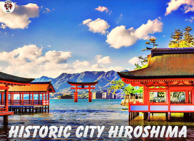 A scenic view of a historic city with traditional Japanese architecture, including red torii gates and wooden structures over water, with mountains in the background. 4
