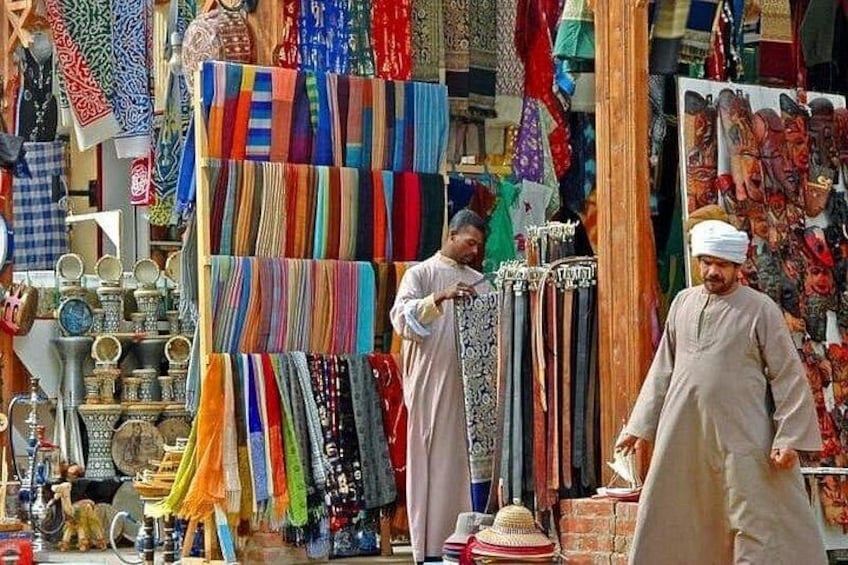 A market with colorful fabrics and traditional items. 3