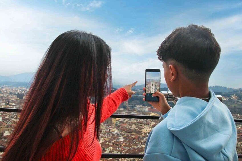 A person taking a photo of a cityscape with a smartphone. 3