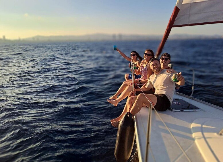 A group of people on a sailboat in the ocean. 5