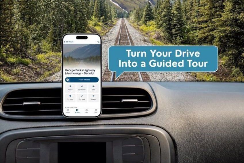 Ein Smartphone an der Autoscheibenhalterung, das eine geführte Touren-App für die George Parks Highway anzeigt. 1