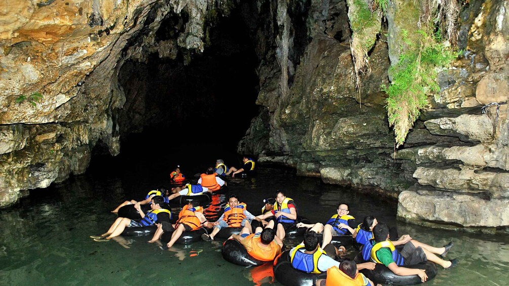 People in inflatable tubes in a cave. 2