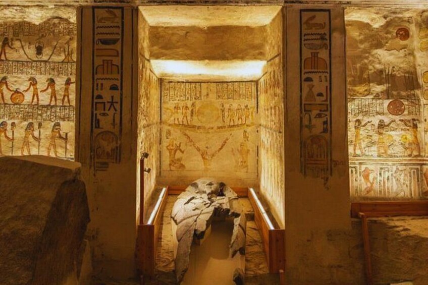 An ancient Egyptian tomb with hieroglyphs and a sarcophagus. 2
