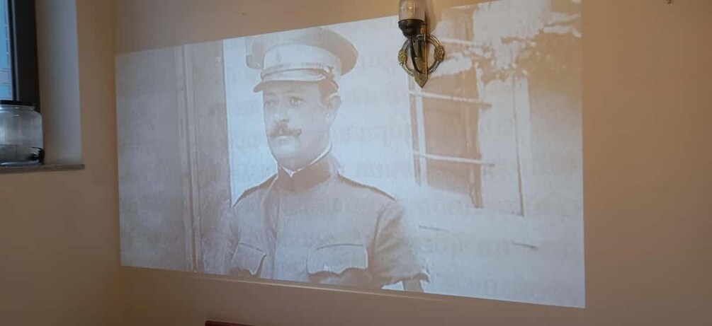 A projection of a historical photograph on a wall. 3