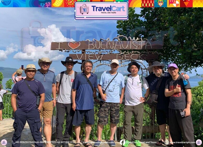 A group of people standing in front of a sign that reads 'I ♥ BUENA AVISTA VIEW DECK.' 4