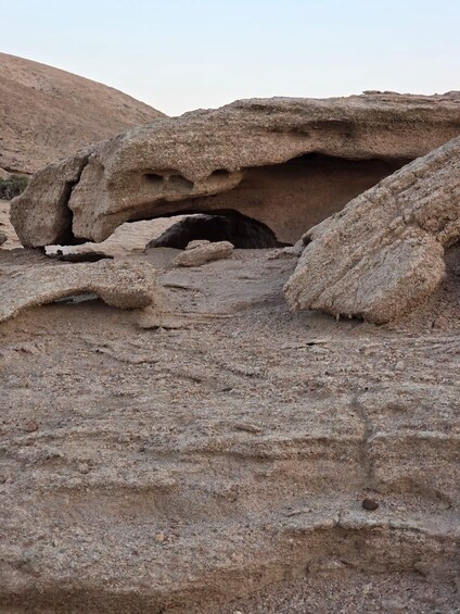 A natural rock formation with a cave-like opening. 2