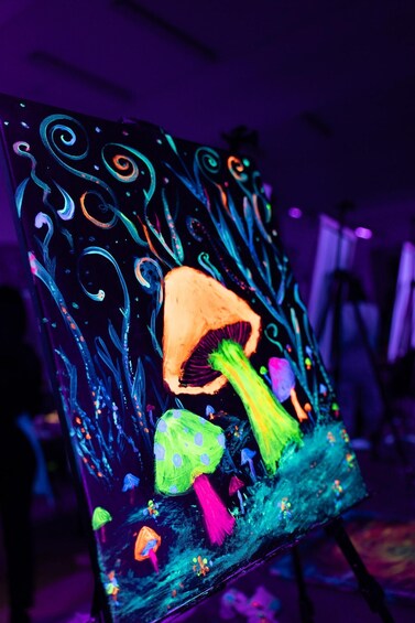 A colorful painting with a large mushroom and abstract designs. 1