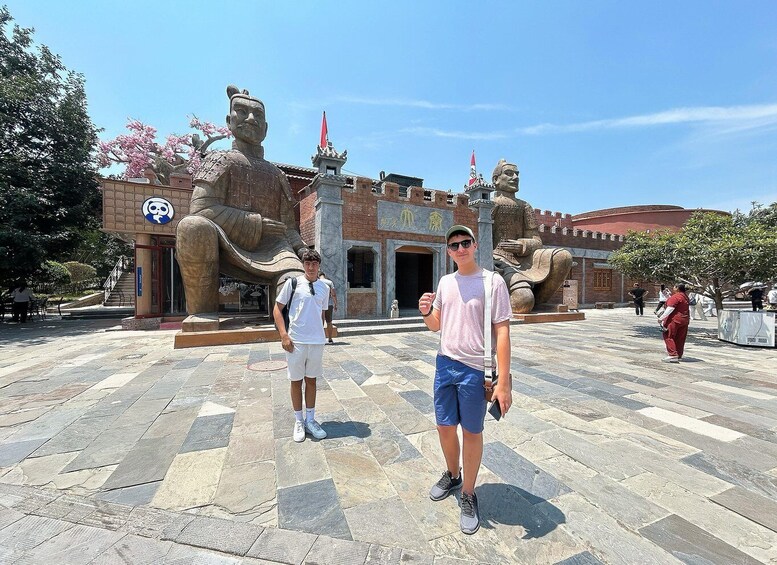 A historical site with large statues and traditional architecture. 4