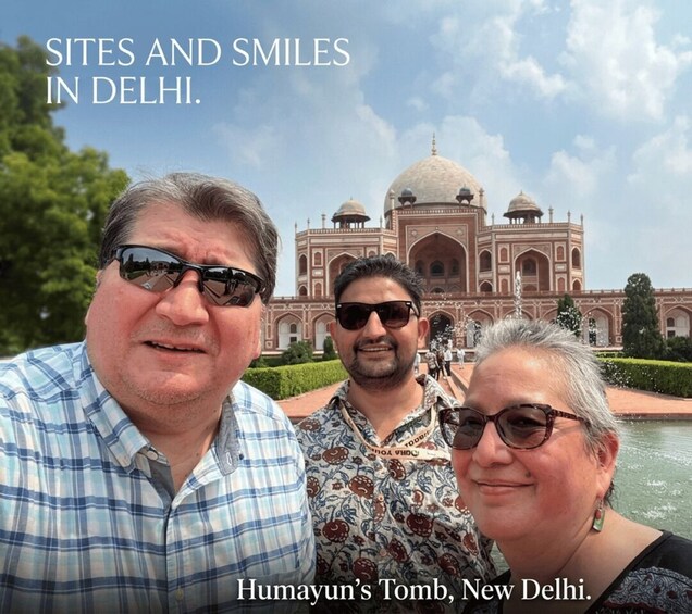 Three people in front of Humayun's Tomb in New Delhi. 1