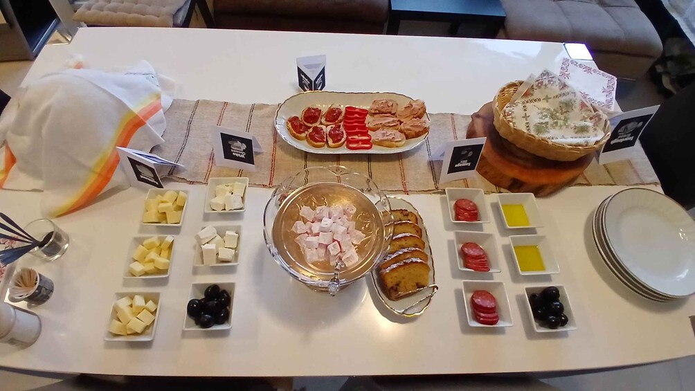 A buffet table with various food items and condiments. 5