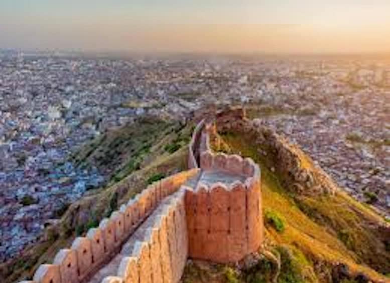 A historic fort overlooking a cityscape. 3