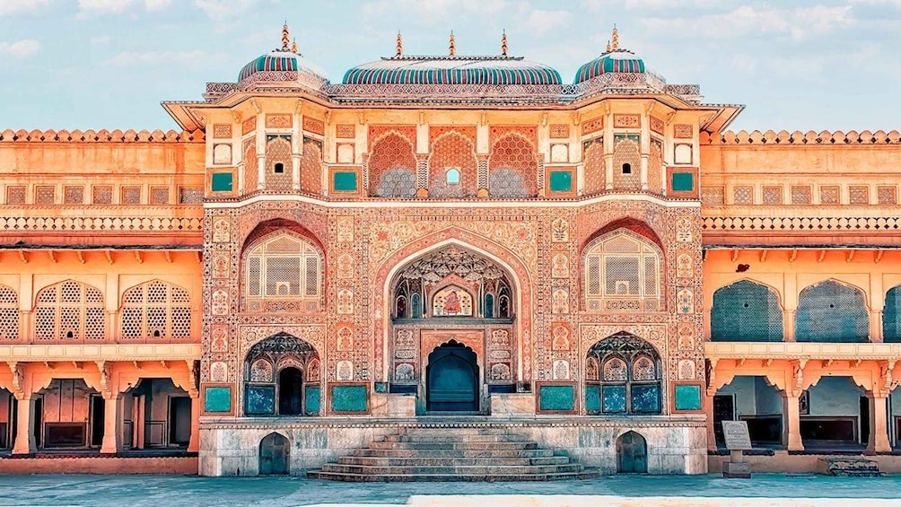 A historic building with intricate architectural details, including domes and arches. 5