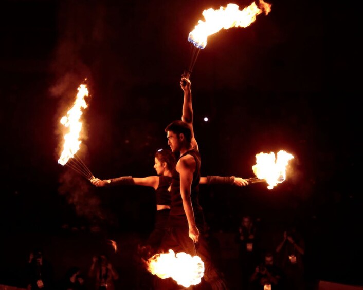 A performer with flaming hoops. 2