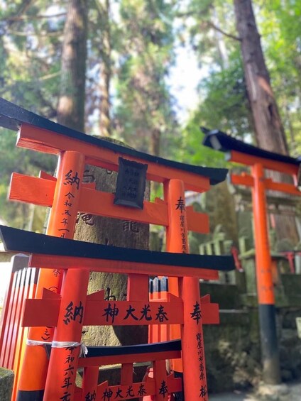 A traditional Japanese torii gate with inscriptions. 3