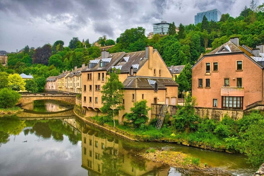 A river with buildings on one side and a bridge in the foreground. 2