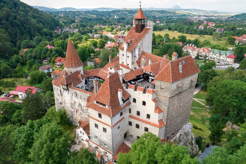A castle with multiple towers and a surrounding landscape. 3