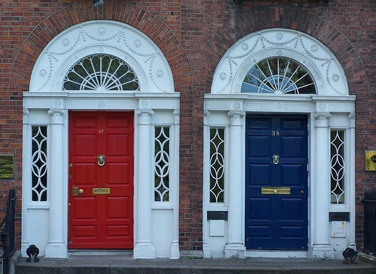 Two doors, one red and one blue, with decorative arches and window designs. 4