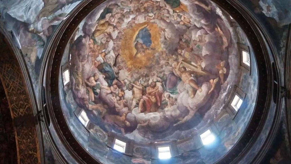 A domed ceiling with a fresco mural, circular windows, and ornate architectural details. 3