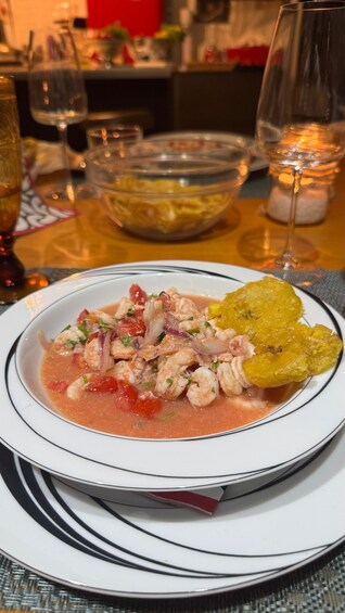 A plate of seafood ceviche with a side of plantain chips. 2