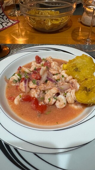 A plate of seafood dish with tomatoes and onions. 4