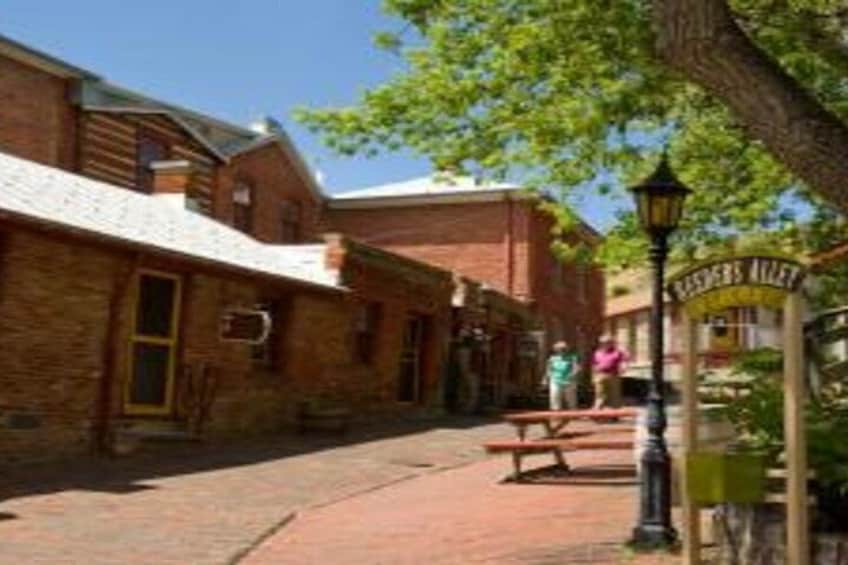 A brick building with a sign reading 'Rasberry Alley.' 3
