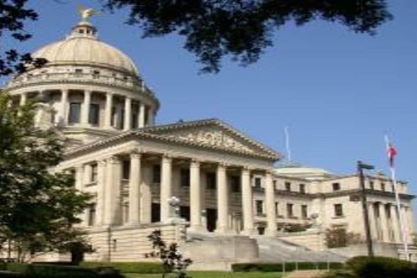A large neoclassical building with a dome and columns, likely a government or historical building. 2