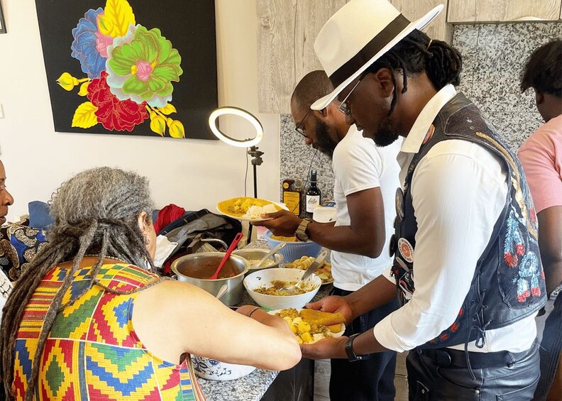A person serving food to another person at a buffet. 1